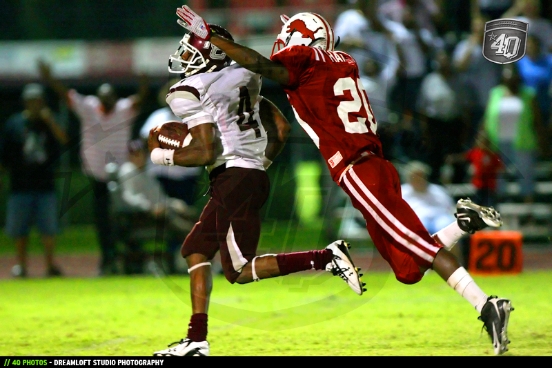 A Leon defender attempts to bring down a Madison county ball carrier