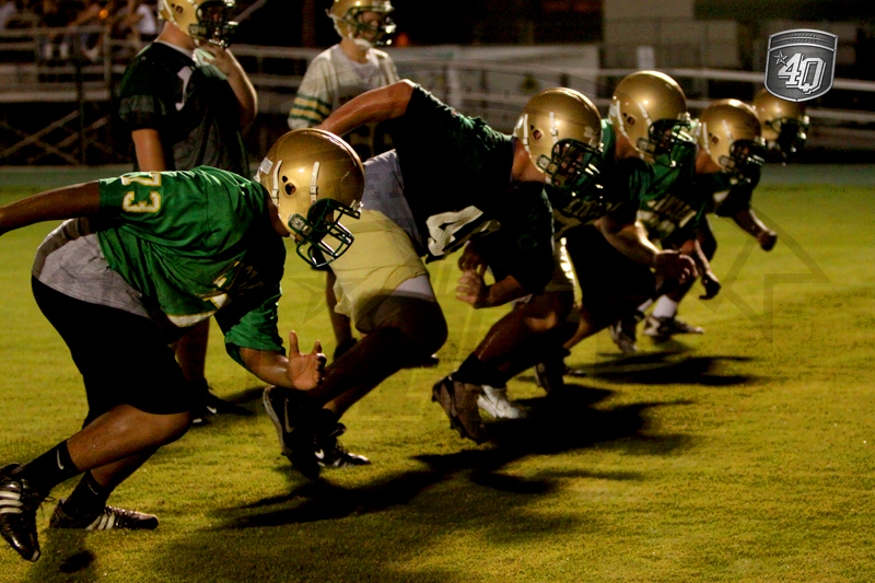 Lincoln linemen practice in a drill