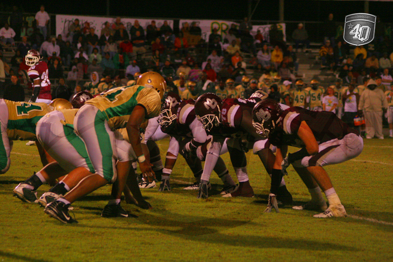 The Madison County offense lines up against the Lincoln Trojan defense