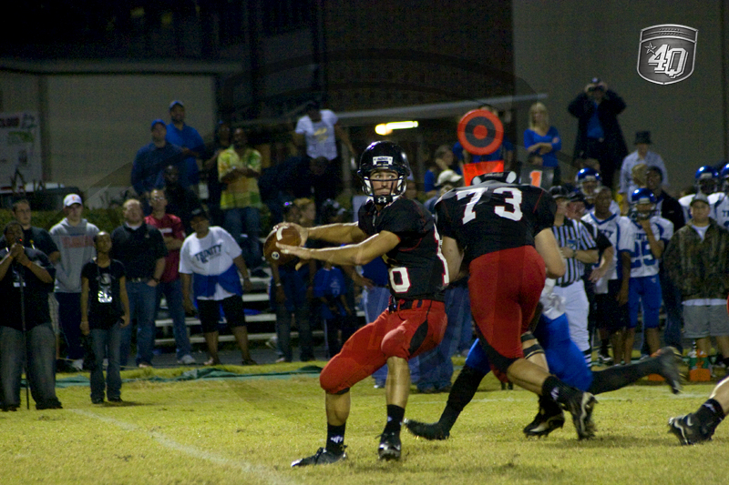 NFC QB #16 C. Trickett makes a throw, while Lineman #73 D. Gentry blocks a defender