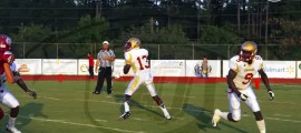 Florida High quarterback D. Harvey drops back for a pass, while RB K. Lewis rolls out. The Seminoles offense has seen a major boost in production this season with more depth and experience .